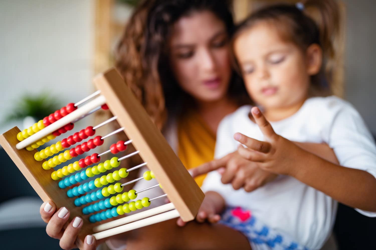 mom giving young child math help