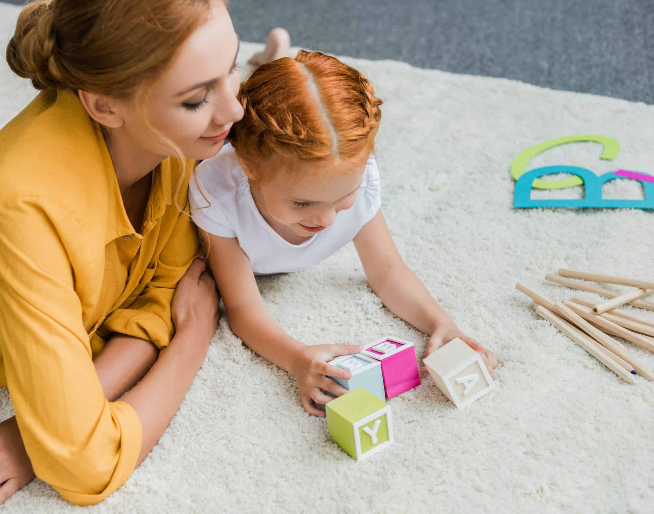 Mom and daughter playing with blocks