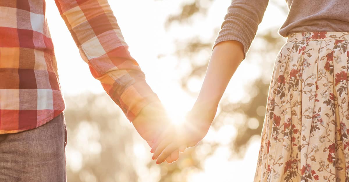 dad and mom holding hands