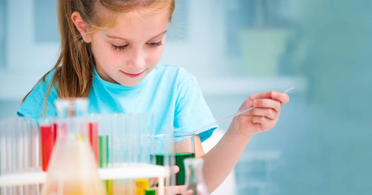 young girl doing a science experiment