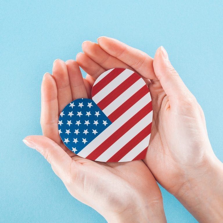 hands holding American flag