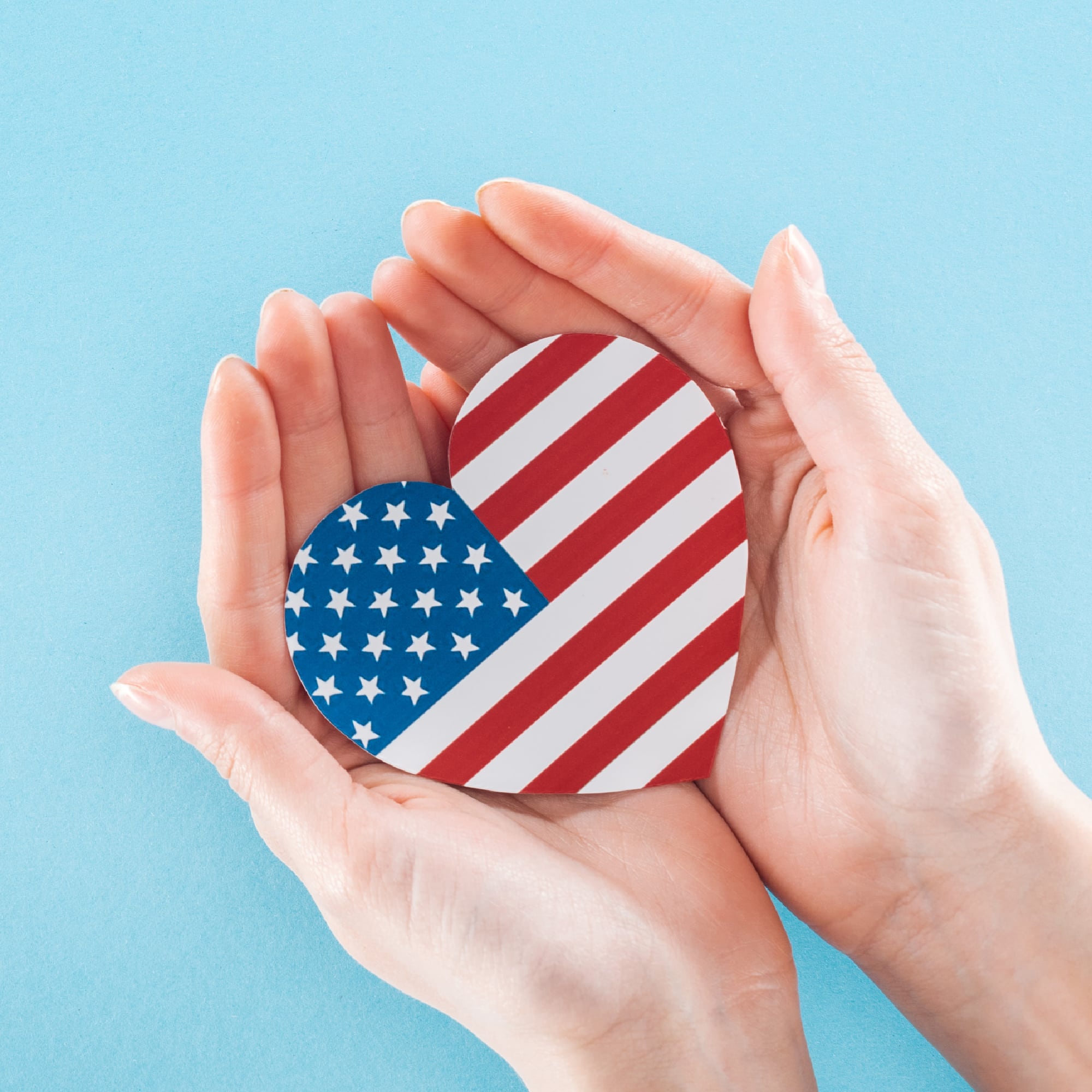 hands holding American flag