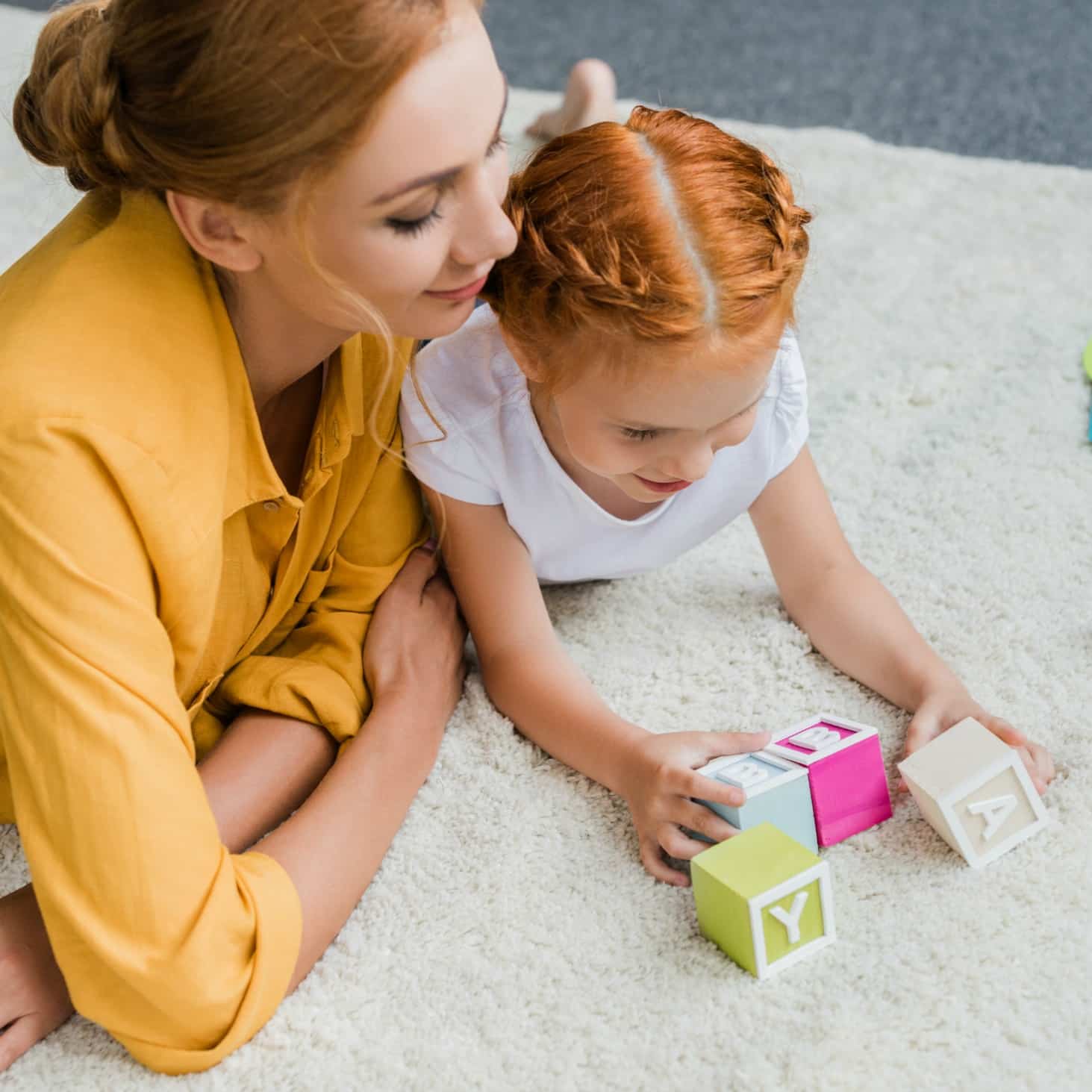 Mom and daughter playing with blocks