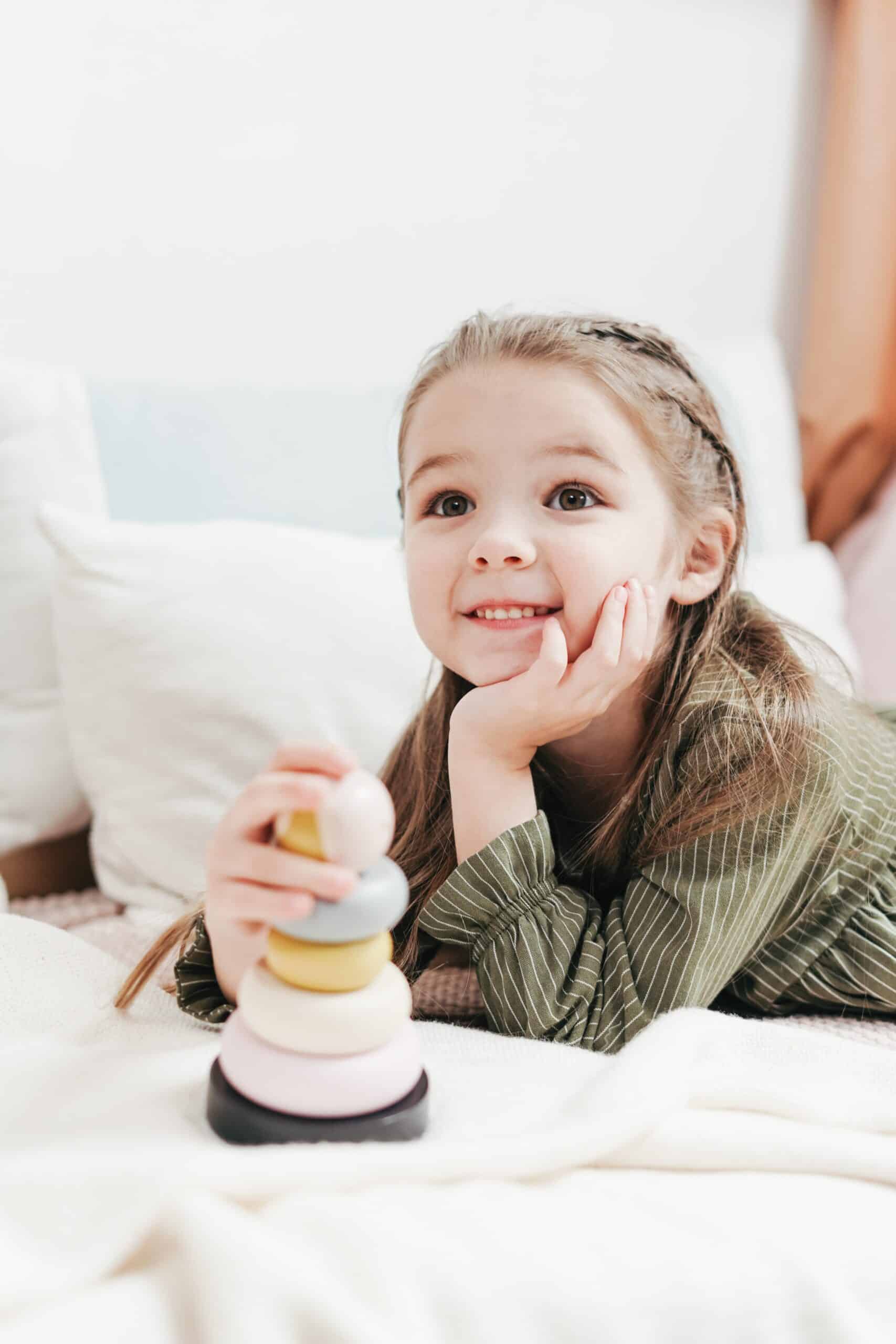 totschool - little girl looking excited about learning